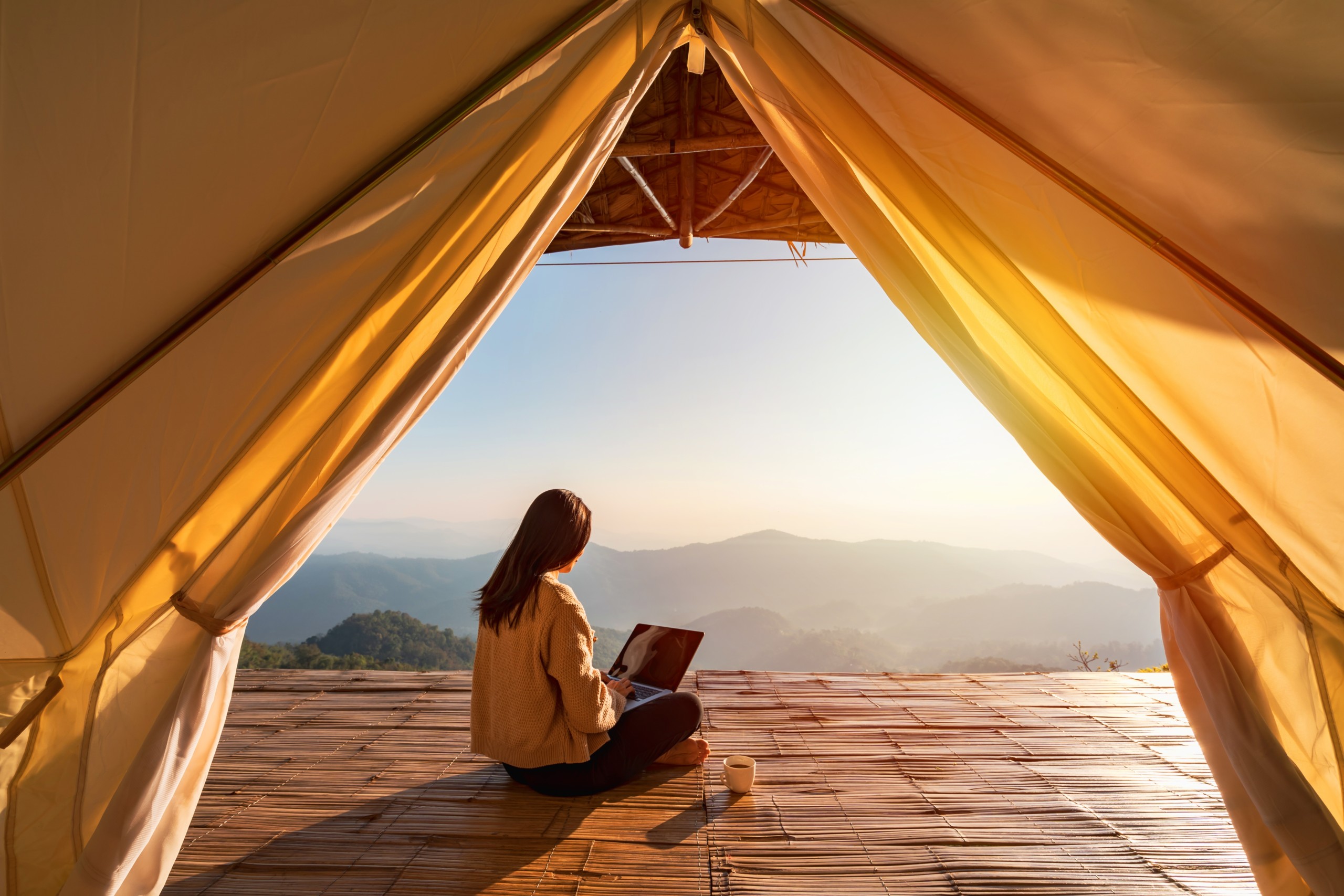 Woman doing a workation in the Mountains